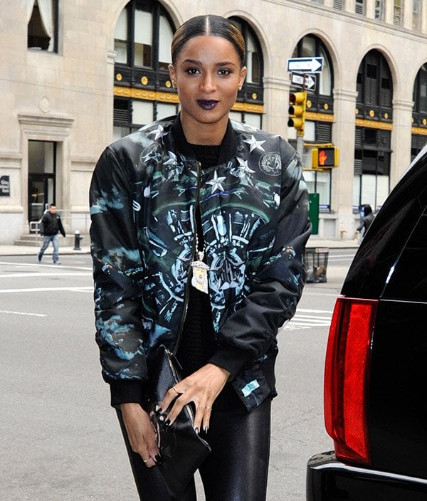 Ciara pairs a Givenchy menswear bomber with a striking Jesus pendant and leather pants for a bold, gender-neutral look