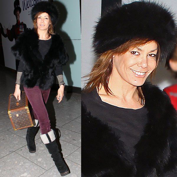 Tara Palmer-Tomkinson in more sensible footwear at Heathrow Airport in London