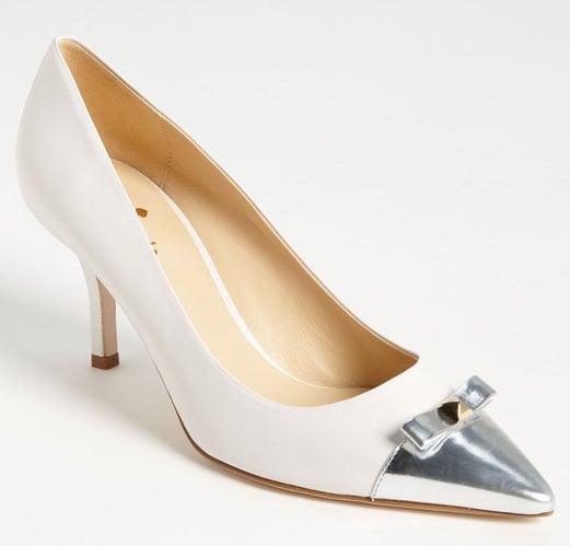 Look sweet and proper in the silver-capped, bow-trimmed "Jiji" pumps.