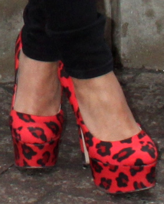 Frankie Sandford displayed her feet in poppy red cheetah-print pumps