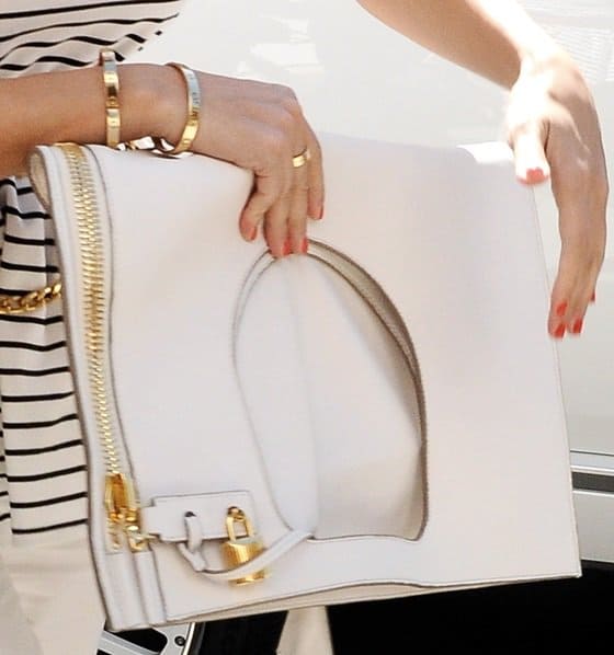 A close-up of Kourtney Kardashian's unique white large foldover clutch