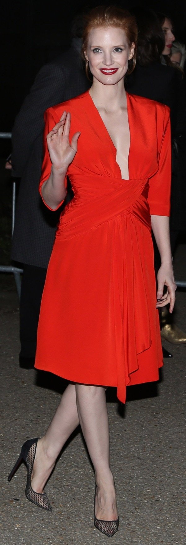 Jessica Chastain turned heads in a red dress at the Yves Saint Laurent show during Paris Fashion Week