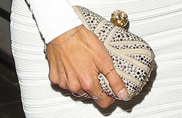 Elegance personified: Alessandra Ambrosio with her Alexander McQueen 'Britannia Skull' clutch, the perfect accessory to her birthday ensemble