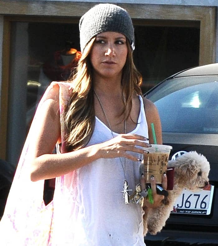 Ashley Tisdale enjoys a leisurely coffee run with her beloved dog, Maui, in Studio City, CA, showcasing a relaxed day-off style