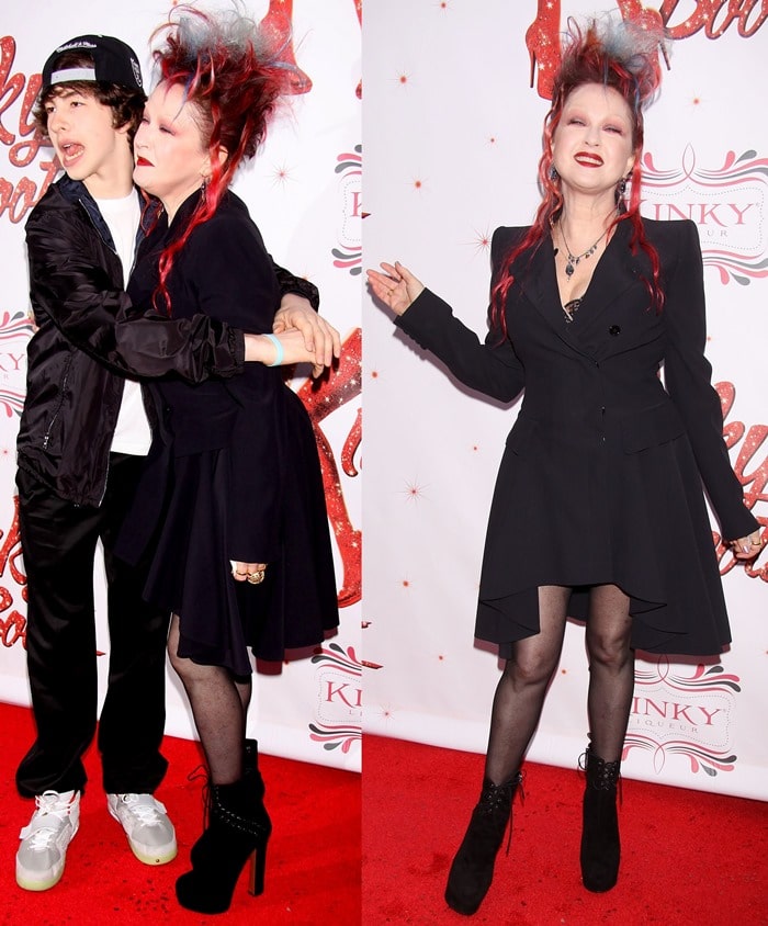 Cyndi Lauper, posing with Declyn Wallace Thornton, in black lace-up booties at the Broadway premiere of 'Kinky Boots' at Hirschfeld Theatre in New York City on April 4, 2013