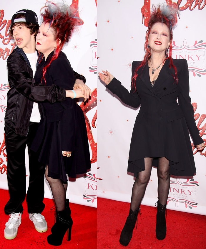 Cyndi Lauper, posing with Declyn Wallace Thornton, in black lace-up booties at the Broadway premiere of 'Kinky Boots' at Hirschfeld Theatre in New York City on April 4, 2013