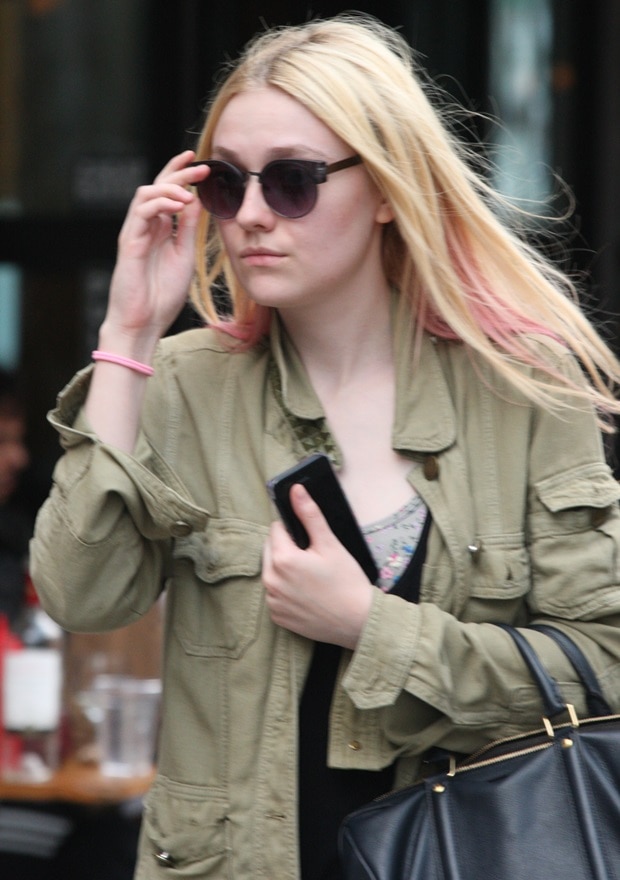 Dakota Fanning wears Quay Eyewear Kat sunglasses with a studded Current/Elliott Commander jacket