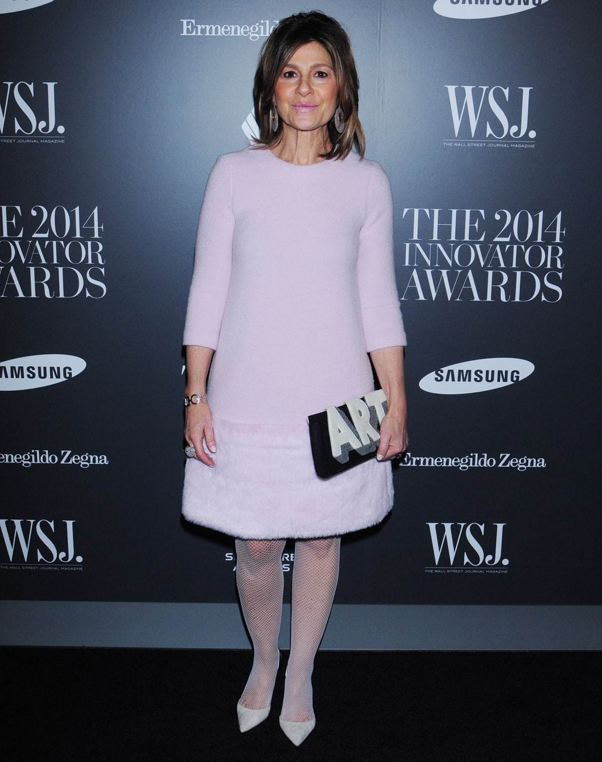 Fashion designer Lisa Perry radiates at the WSJ. Magazine 2014 Innovator Awards, blending contemporary flair with the spirited charm of the 1960s