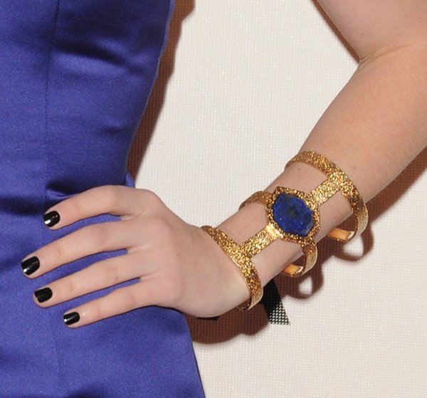 Emma Roberts' majestic cuff, featuring vibrant blue lapis against 18k-gold-plated brass