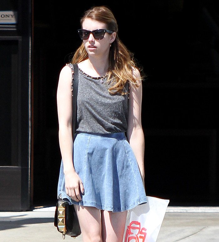 Emma Roberts in a denim skater skirt from Topshop with a spike detail tank top from the same brand