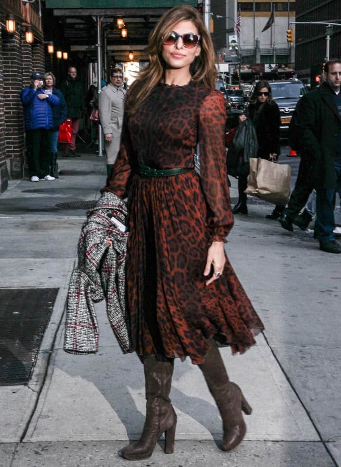 Eva Mendes in a sultry Dolce & Gabbana animal-print long-sleeved dress featuring an intricately embroidered neckline that was perfectly accentuated by a stylish green leather belt outside the Ed Sullivan Theatre for her appearance on the Late Show with David Letterman