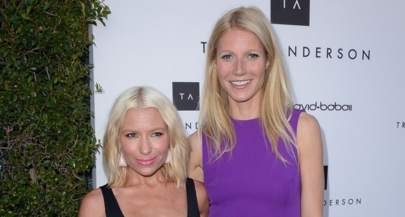 Three women make a striking statement on the street, each showcasing a unique take on the purple dress trend, accessorized with coordinated high heels
