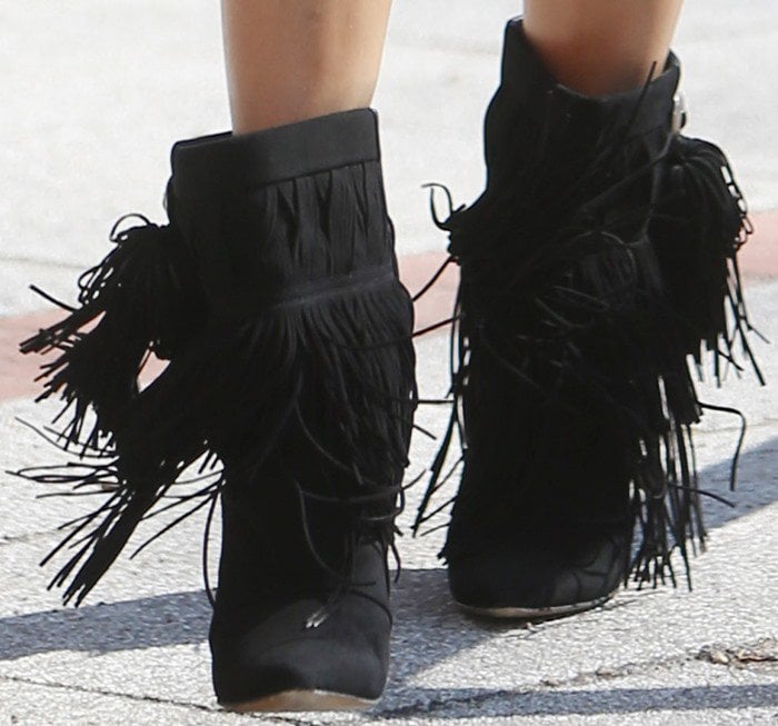 Sylvie van der Vaart wears a pair of fringed boots from Isabel Marant