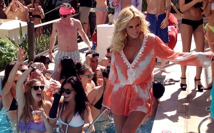 Jenny McCarthy wears a coral-and-white tunic poolside in Las Vegas