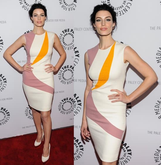 Jessica Paré effortlessly showcases Roksanda Ilinčić's 'Efra' dress, where bold geometric color-blocking meets a sleek, sculptural updo for a perfect blend of retro and modern elegance