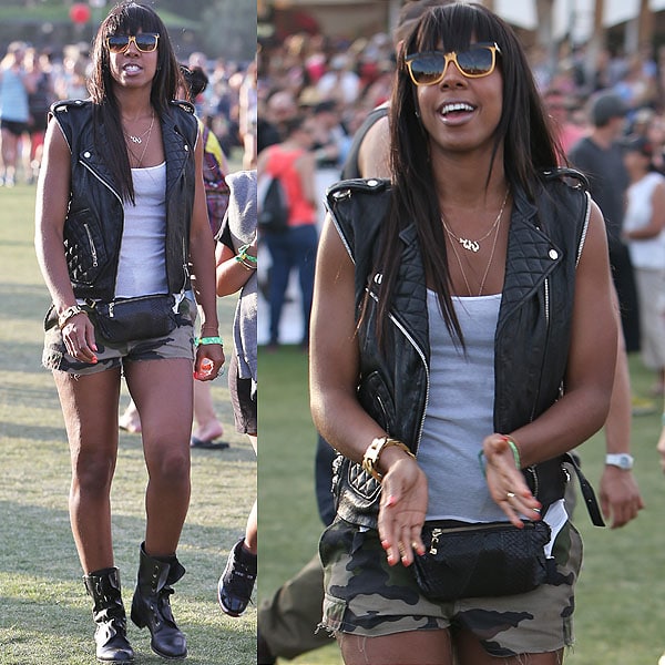 Kelly Rowland is one tough chick in a leather biker vest, camo shorts, combat boots, and ... a fanny pack?