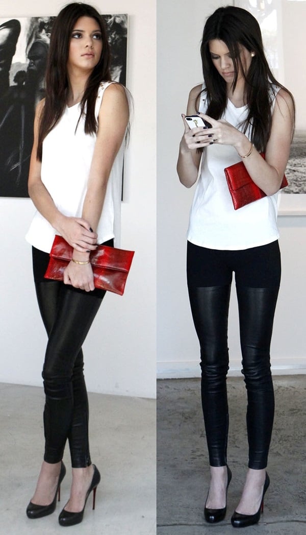 Kendall Jenner with a hot red snakeskin foldover clutch at the Nomad Two Worlds and Russell James Private Reception