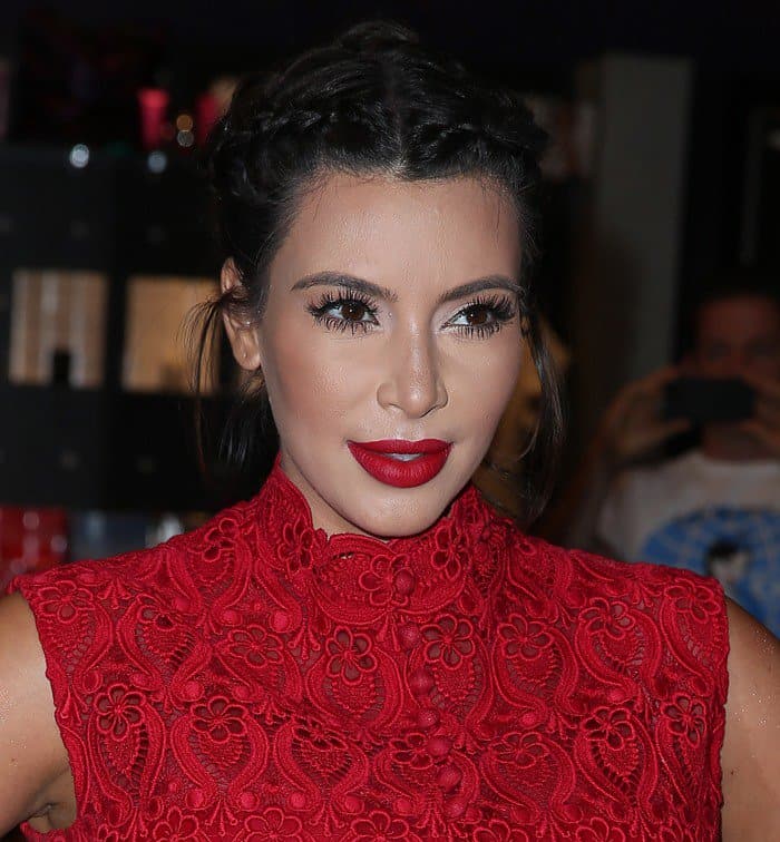 Kim Kardashian in a red Valentino macramé lace dress