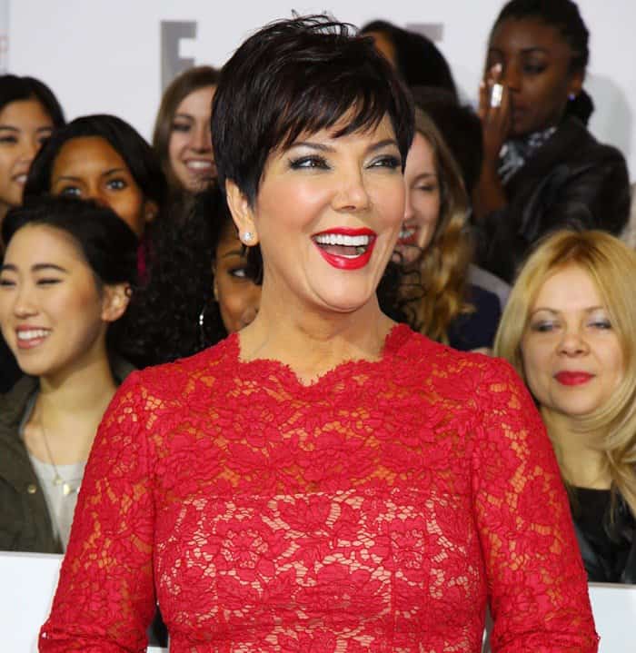Kris Jenner exudes elegance in a Valentino red lace dress at the 2013 E! Upfront Presentation in NYC