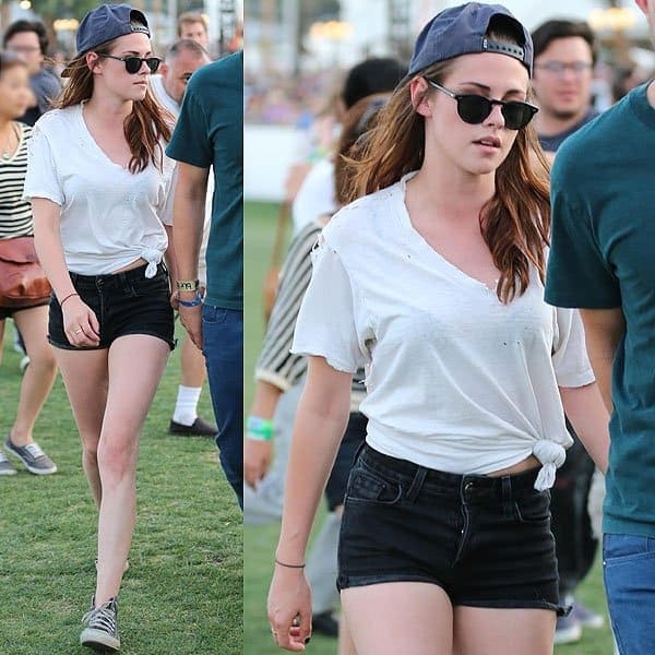 Kristen Stewart's repetitive knotted t-shirt and short shorts combo fails to inspire amid the vibrant Coachella fashion scene