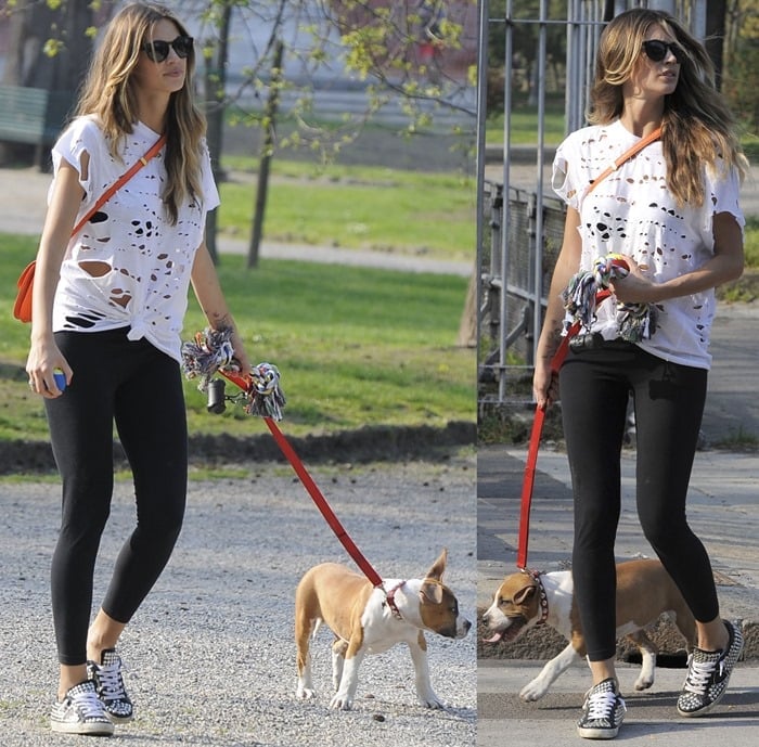 Model Melissa Satta walking her dog in a park in Milan on April 18, 2013