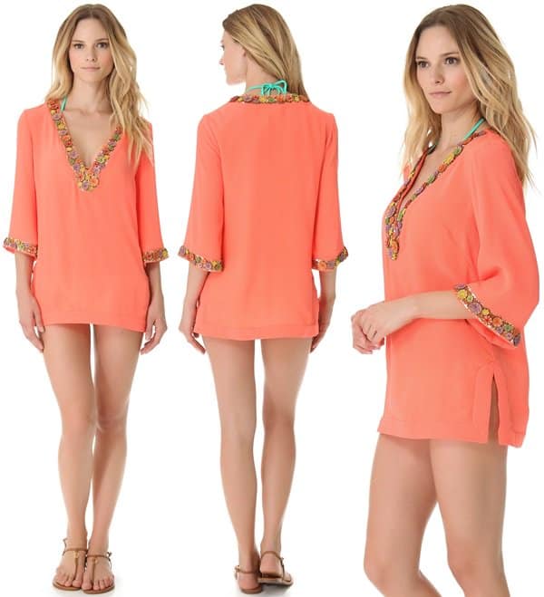 Vibrant thread secures rustic wooden beads as they trace the plunging V neckline and cuffs of this crinkled coral tunic
