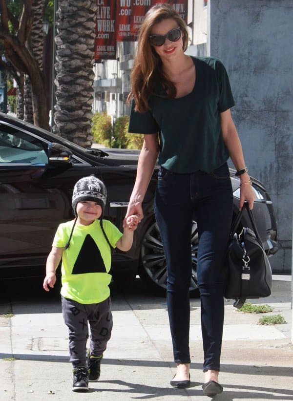 Miranda Kerr and her adorable son Flynn Christopher step out from a fun day at a kids' gym in Los Angeles, showcasing her effortless street style