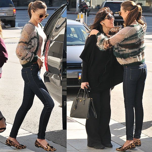 Miranda Kerr stepped out in Los Angeles wearing a casual-chic ensemble featuring a sheer Isabel Marant Etoile V-neck t-shirt, Nobody Cult skinny jeans, a Rodarte loose knit cardigan, Miu Miu 10ns Cat Eye sunglasses, and Prada logo-studded tassel loafers