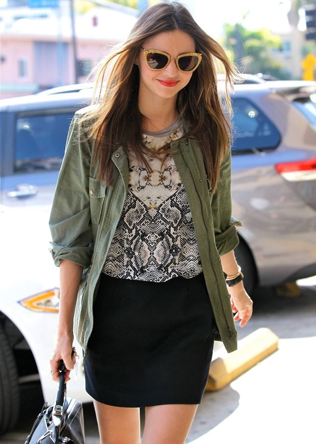 Miranda Kerr in a Josh Goot Fall 2013 python-print shirt paired with a camo jacket arrives at a nail salon