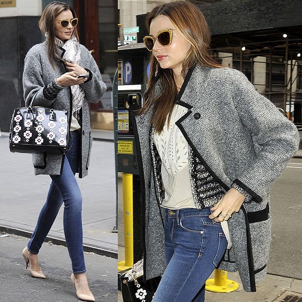 Miranda Kerr stepped out in New York sporting an eclectic mix of designer pieces, including Frame Denim Le Skinny De Jeanne jeans, a Prada Floral Applique Spazzolato bag, an Isabel Marant Khan tweed coat and Barte striped cardigan, Miu Miu sunglasses, Acne skinny jeans, an Isabel Marant embroidered top, Celine pumps, and a Mulberry tiger print scarf