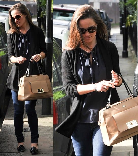 On April 15, 2013, in London, Pippa Middleton elegantly styled a Tory Burch Tanya top in medium navy with Nicholas Kirkwood patent leather loafers, accessorized with a Milli Millu Vienna bag in cappuccino, a Hermes Clic H cuff in grey, Stella McCartney round tortoiseshell sunglasses, and a Project D auto crystal two-tone stainless steel silver-tone dial watch