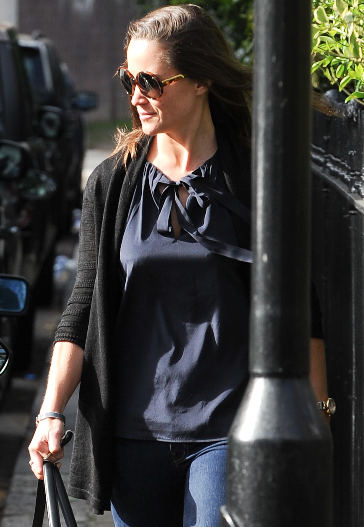 Pippa Middleton wears a navy Tory Burch Tanya top and Stella McCartney round tortoiseshell sunglasses