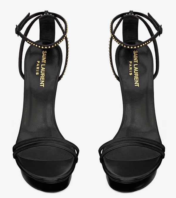 These sandals feature double straps at each vamp and adjustable ankle straps