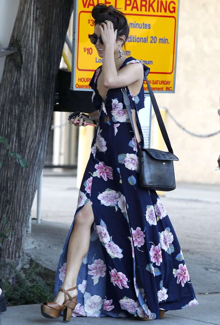 While taking a leisurely stroll in Los Angeles, Vanessa Hudgens turned heads in a stunning floral maxi dress with chic cutout details