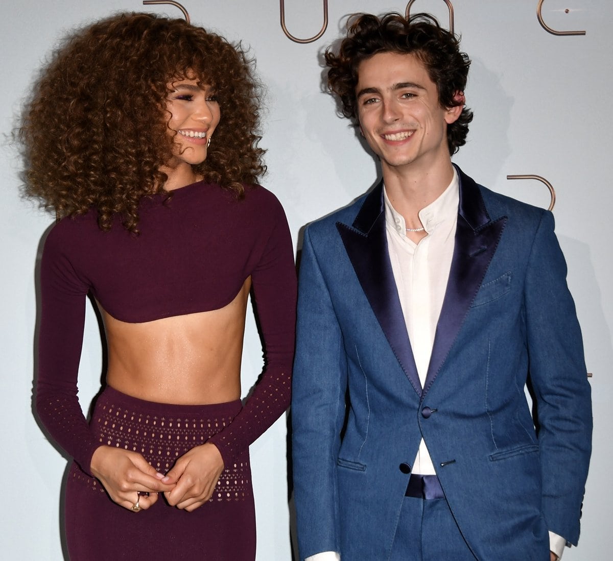 Zendaya in a two-piece knitted look from Alaia’s Spring 2022 collection and Timothée Chalamet in Tom Ford at the premiere of Dune at Le Grand Rex