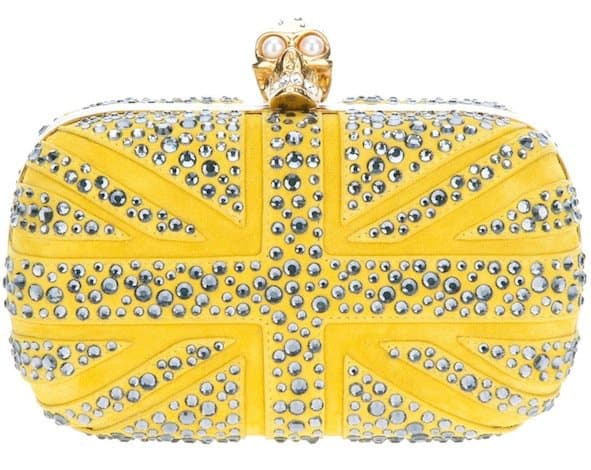 Make a statement with Alexander McQueen's 'Britannia Skull' Clutch Bag in vibrant yellow - a luxury piece that combines fashion with art