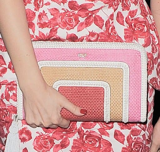 Kelly Brook's eye-catching tricolored clutch adds a playful touch to her look
