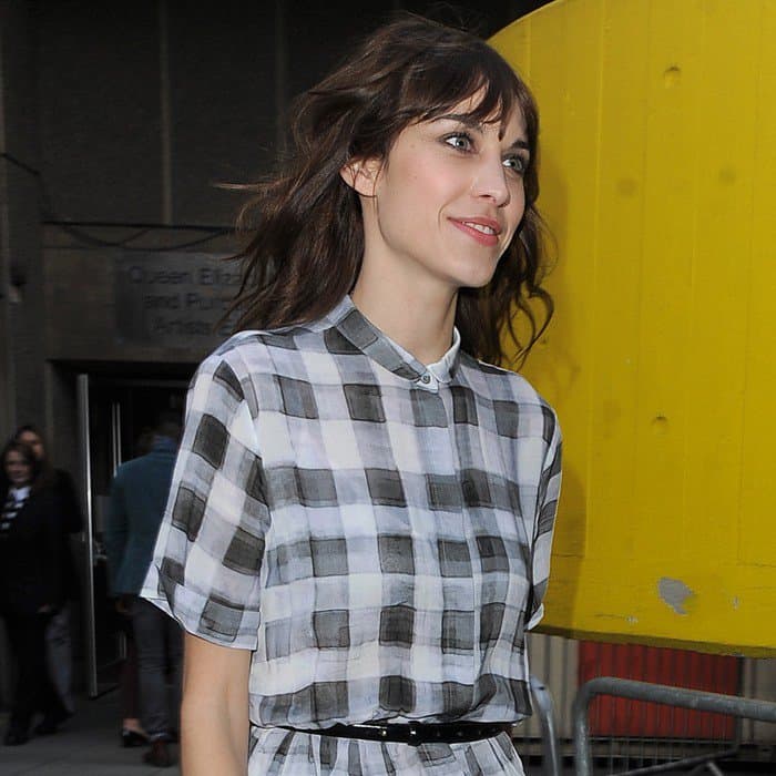 Alexa Chung departs from a Vogue event, showcasing her relaxed, chic style on a London street, dated April 27, 2013