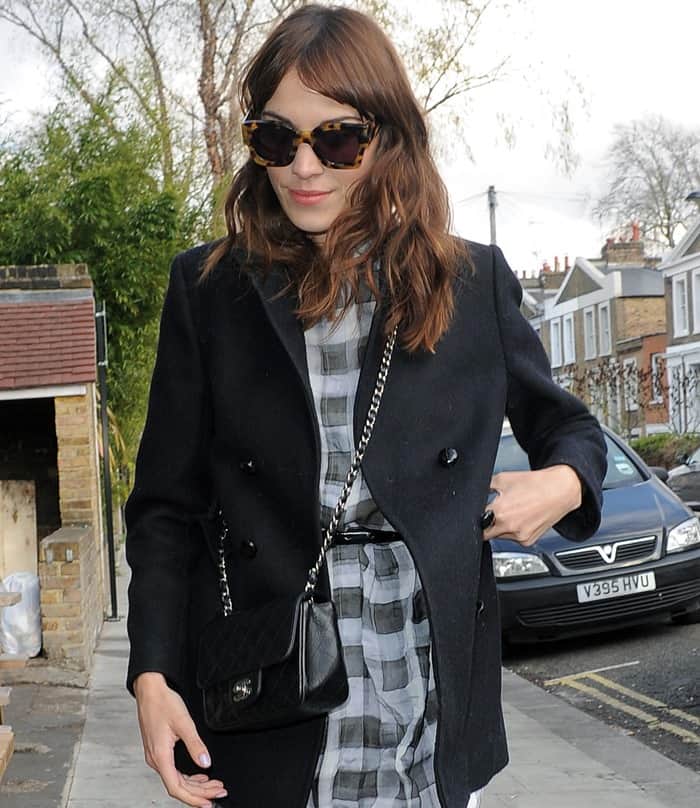 Style icon Alexa Chung leaves a Vogue seminar, blending vintage flair with modern fashion in London, April 27, 2013