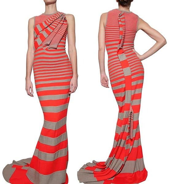 Stand out with Amaya Arzuaga's vibrant orange striped knit wool gown, priced at $849, blending warmth and style for gala events