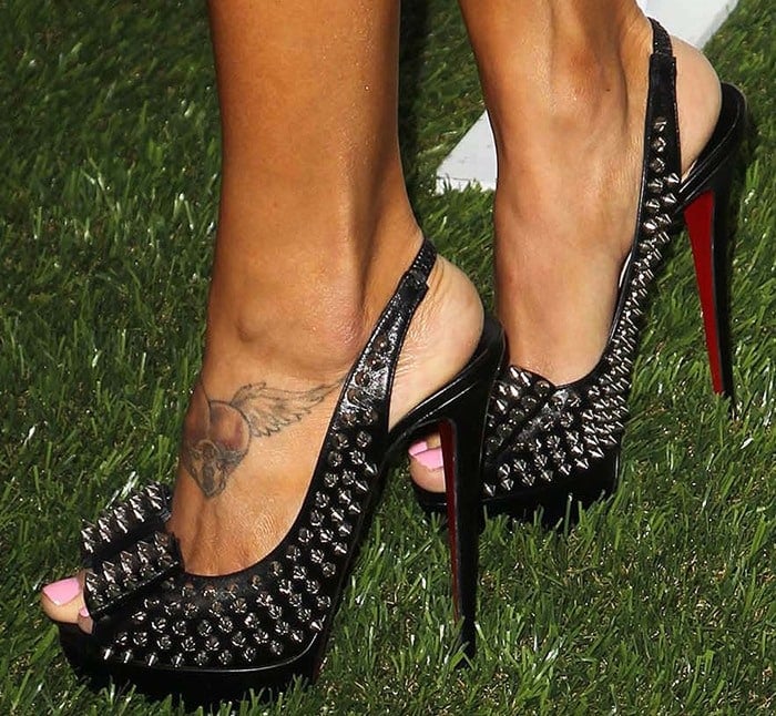 Arianny Celeste shows off her size 7.5 (US) tattooed feet in spiked ‘Clou Noeud’ heels from Christian Louboutin