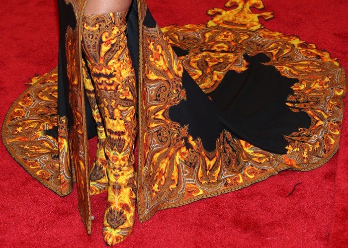 Beyoncé Giselle Knowles-Carter styled her dress with over-the-knee-boots in the same gold paisley fabric