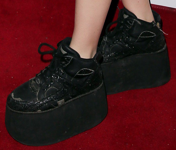 Charli XCX's feet in Buffalo Classic sneakers