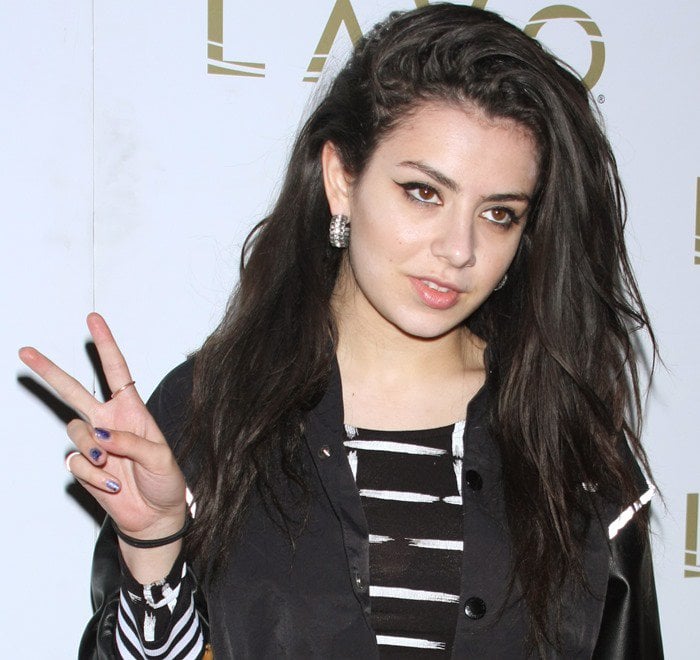 Charli XCX flashes a peace sign at Lavo Nightclub in Las Vegas
