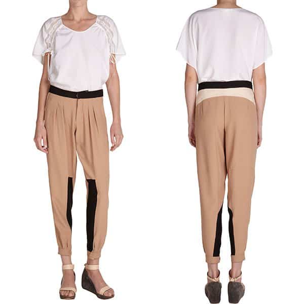 Close-up of Chloe’s color-blocked pleated pants featuring tan and black design, priced at $995