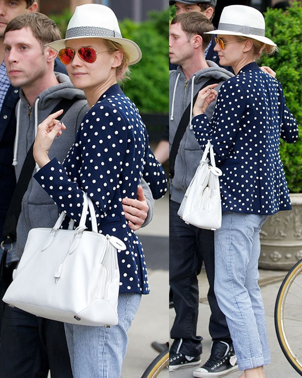 Diane Kruger was spotted in New York on May 7, 2013, stylishly outfitted in Christian Louboutin ballet flats, a Rochas bag, a studded Diane von Furstenberg jacket, and Ray-Ban aviator sunglasses