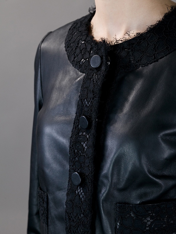 Full-length view of Dolce & Gabbana’s leather and lace cropped jacket, highlighting its unique design and elegant craftsmanship