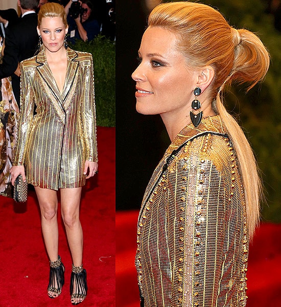 Elizabeth Banks wears a gold chainmail Versace jacket