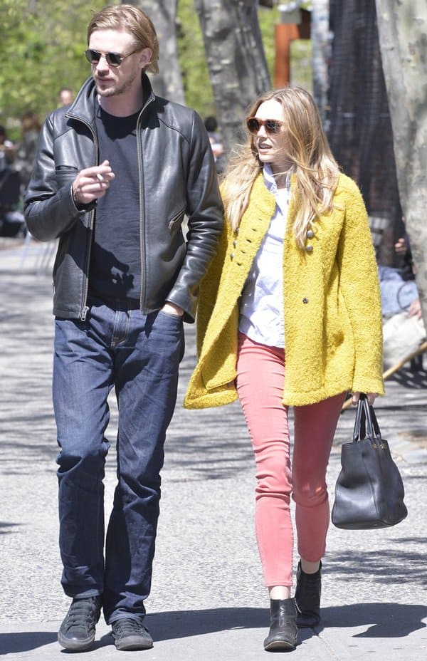 Elizabeth Olsen strolls through SoHo with Boyd Holbrook, embracing the spring season in vibrant attire, New York City, April 30, 2013