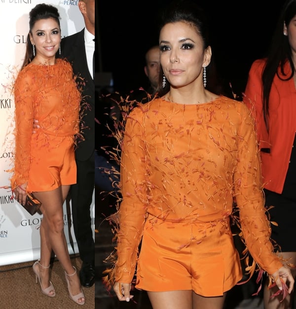 Eva Longoria stuns in a bright orange feather-detailed Emilio Pucci top paired with matching shorts and nude Brian Atwood 'Evie' heels